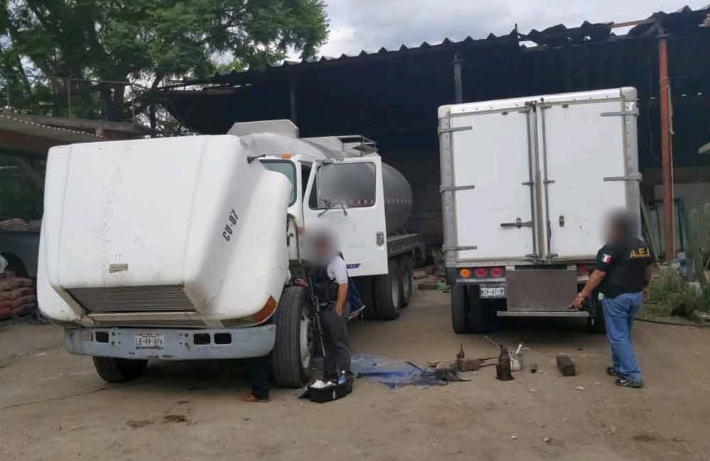 Asegura FGEO vehículos y mercancía robados, en cateo en Ocotlán